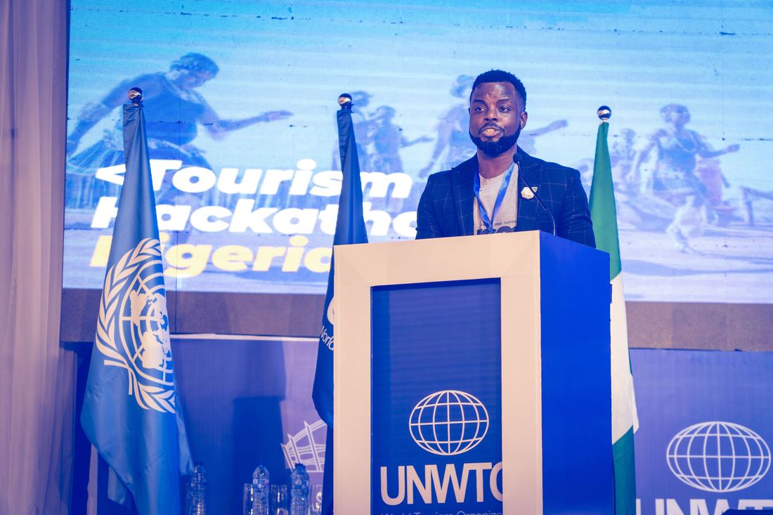 Ayoola Gbade-Bello on stage at the 2022 Tourism Hackathon Nigeria, Lagos