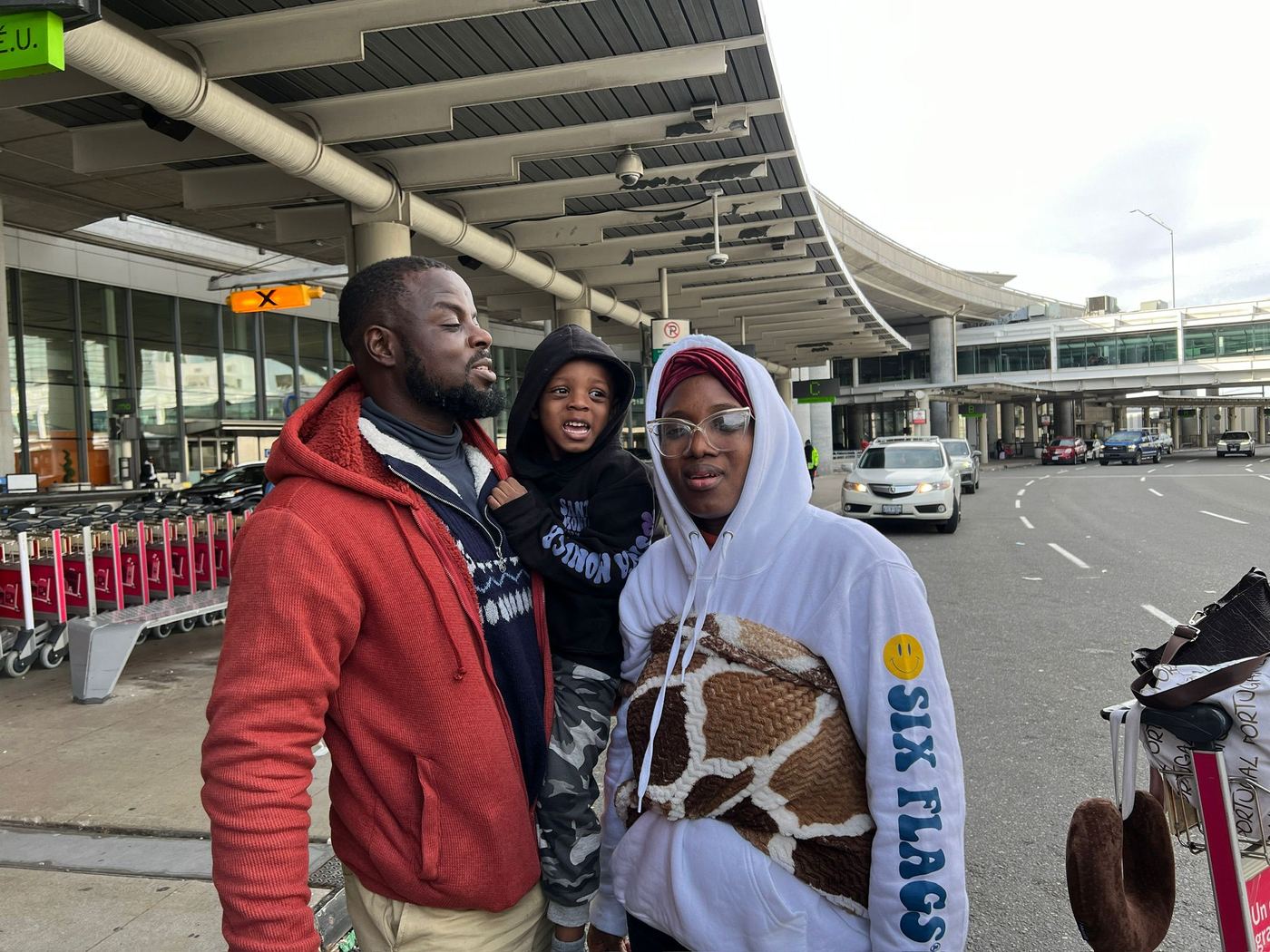 Ayoola Gbade-Bello and family outside Toronto Pearson Airport, November 2023