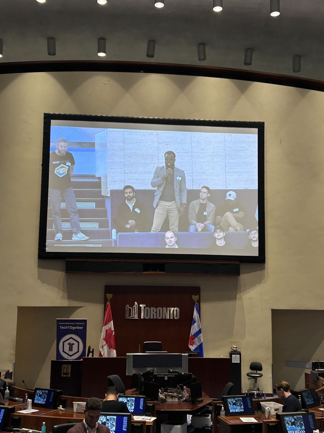 Ayoola Gbade-Bello presenting Kintrace on stage at TechTO, Toronto City Hall