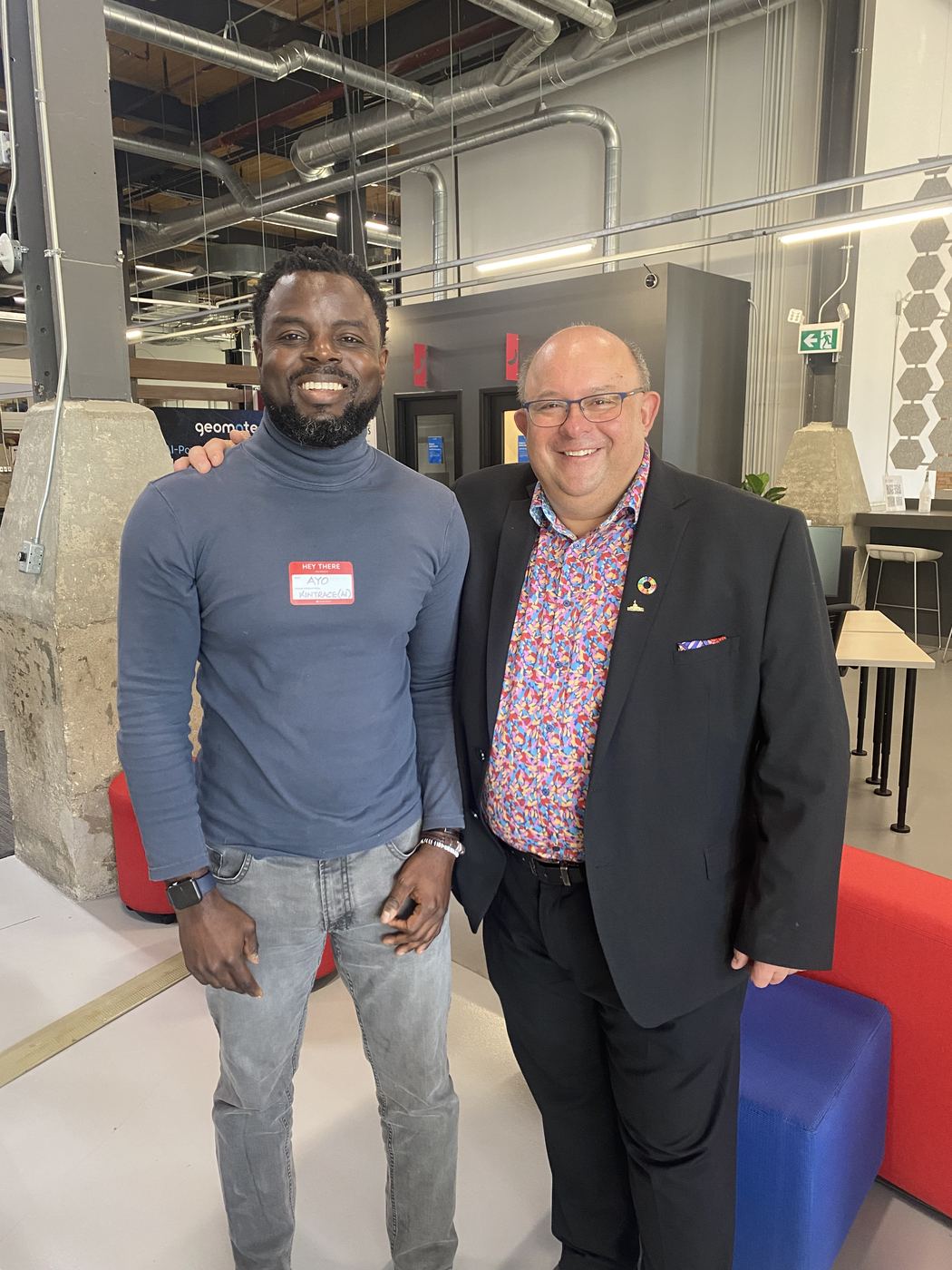 Ayoola Gbade-Bello with Kitchener Mayor Berry Vrbanovic at the Communitech Startup Bootcamp